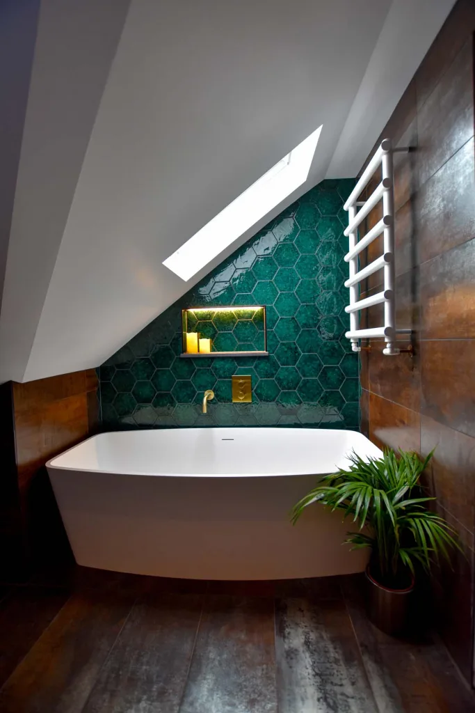 Bath in green tiled bathroom